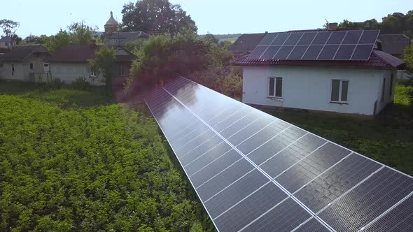 Blue solar panels for clean energy on green grass.