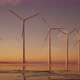 3D animation of offshore wind turbines at sunset. Wind Farm, renewable energy. - VideoHive Item for Sale