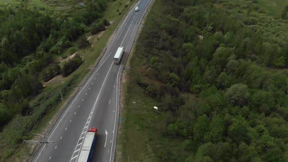 Aerial View of White Truck Passing Busy Highway