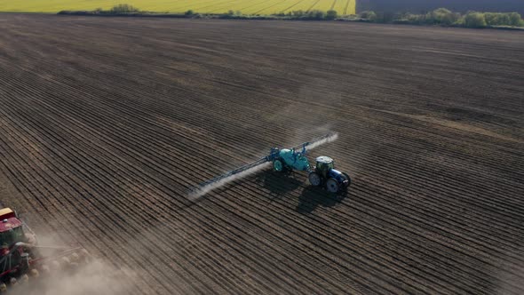 Aerial view of a tractor that irrigates agricultural field