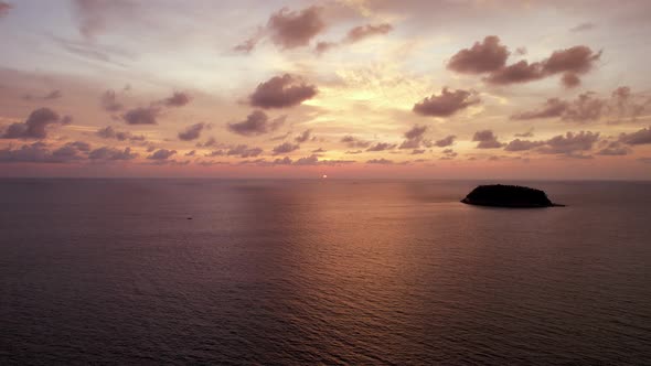 Luxury Yacht at Sunset with a View of the Island