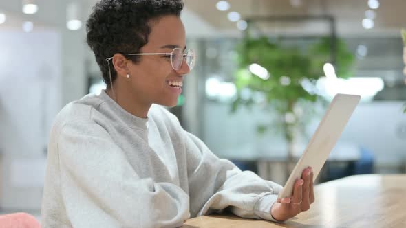 Online Video Call on Tablet By Casual African Woman 