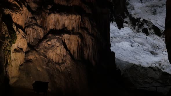 Ancient formations of stalactites and stalagmites slow tilt 3840X2160 UHD footage - Area deep inside