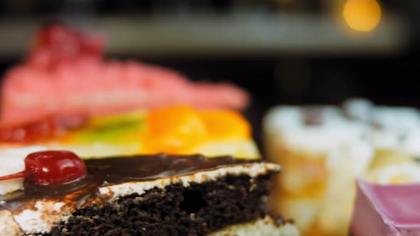 Pieces of Different Cakes on a Retrostyle Baking Tray