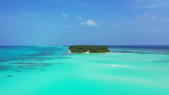 Aerial tourism of paradise coast beach voyage by blue ocean with white sandy background of a dayout 