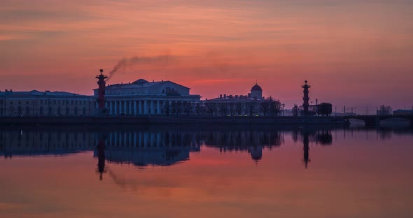 Timelapse of Old Stock Exchange Building and Rostral Columns in Dusk Water Area of Neva River at