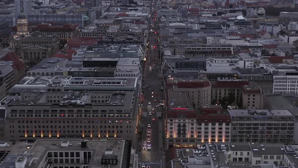 AERIAL: Beautiful View Over Berlin Mitte Office Buildings and Car Traffic City Lights on Cloudy Day