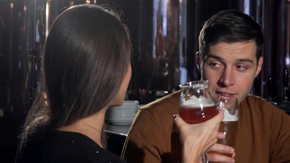 Beautiful Woman Smiling To the Camera After Clinking Glasses with Boyfriend