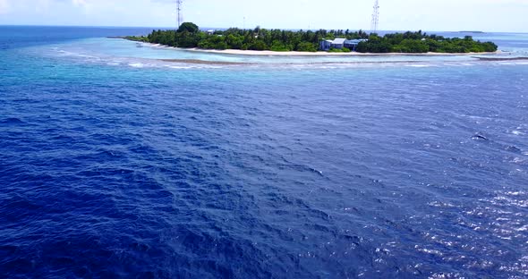 Luxury fly over clean view of a summer white paradise sand beach and blue sea background in colorful