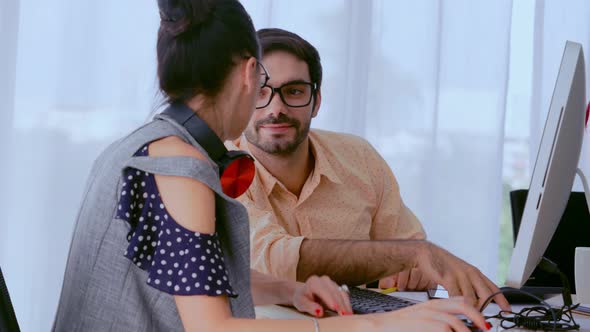 Creative Business People Group Having Conversation at Office Desk in Workplace