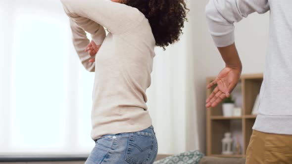 Happy African American Couple Dancing at Home