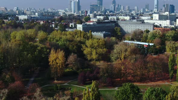 Urban green place unveiling Warsaw city skyline with gigantic stock buildings, nature meets modern l