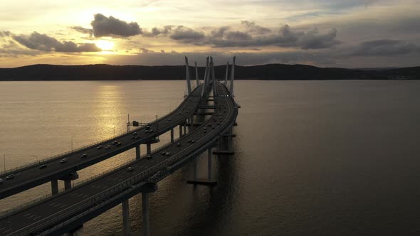 An aerial shot of the Mario M. Cuomo Bridge from the north side. The drone dolly in over the bridge,