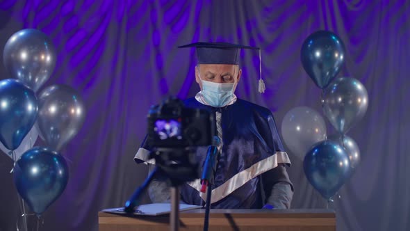 Male Lecturer Wearing Medical Mask Observes Precautions Congratulate Graduates on Graduation Online