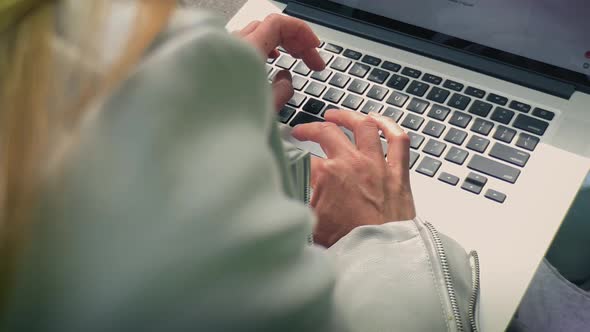 Young Woman Writes an Email