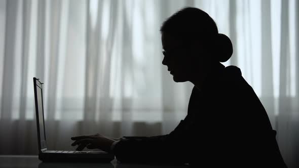 Silhouette of Female Journalist Typing on Laptop, Short Terms of Article Release