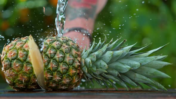 Super Slow Motion Shot of Pineapple Chopped with a Knife at 1000 Fps