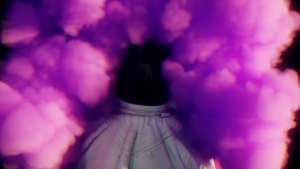 Explosion of Colorful Bright Smoke Enveloping the Astronaut