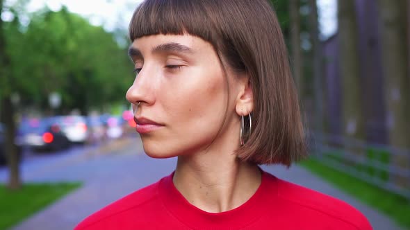 Portrait of Beautiful Millenial Woman on the Street with Smile