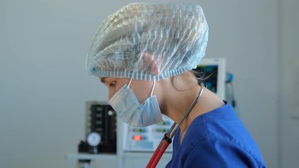 Female Assistant of Surgeon in Operating Theatre