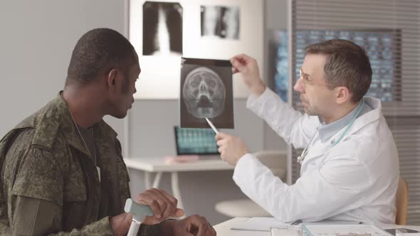 Doctor Showing Soldier His Orbital X Ray