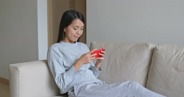 Woman Play Game on Cellphone