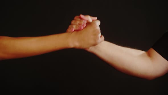 Diverse People Making Handshake Gesture Isolated on Black Background