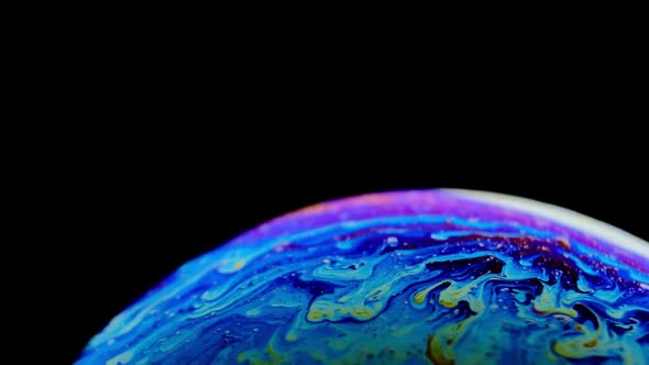 Multicolored Rainbow Colors of a Single Soap Bubble That Looks Like a Fantasy Planet Isolated