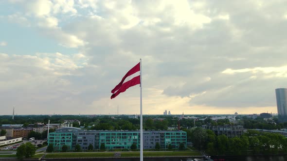 Drone View of a Big Flag of Latvia in Riga the City in the Background