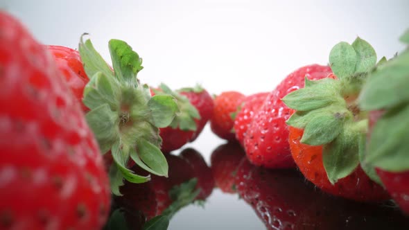 Ripe Fresh Natural Strawberries in Reflection in Extreme Macro Close Up