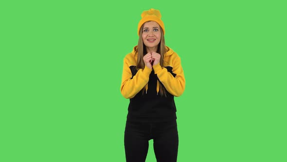 Modern Girl Is Looking at Camera with Excitement, Then Celebrating Victory. Green Screen