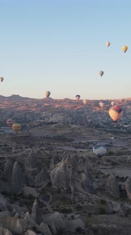 Vertical Video of Hot Air Balloons Flying in the Sky Over Cappadocia Turkey