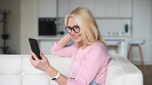 Middleages Woman Using Smartphone for Video Call