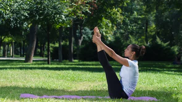 Girl Is Doing Yoga in Park