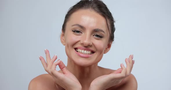 Smiling Woman Touching Healthy Skin Portrait