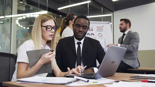 Young Business People which Analizing the Business Project on Computer Screen