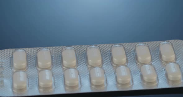 Prescription drugs - Capsules, pills, tablets on reflective background