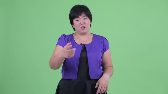 Angry Young Overweight Asian Woman Talking and Complaining