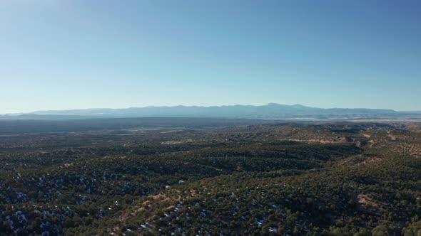 Wide landscape aerial moving across winter desert landscape in daytime, 4K