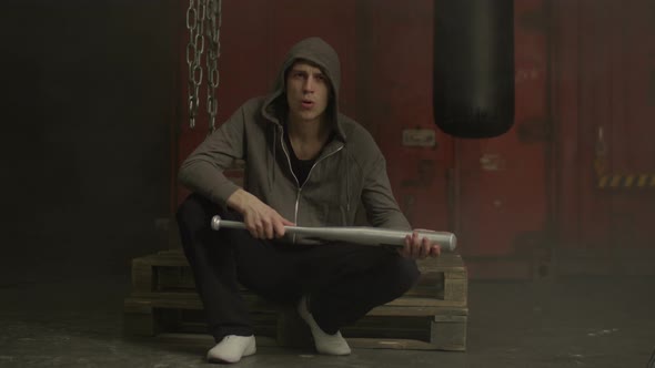 Mean Guy Holding Baseball Bat with Threatening Look