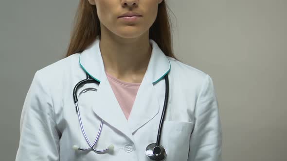 Physician Holding Black Ribbon, Melanoma Awareness Concept, Cancer Prevention