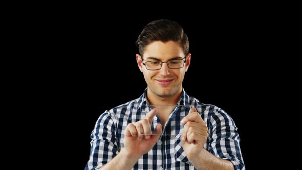 Smiling man using futuristic digital tablet