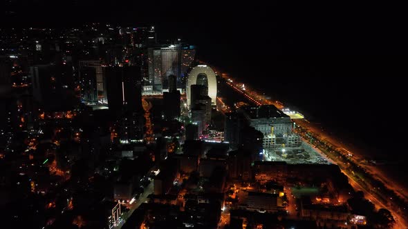 Batumi, Georgia - July 15 2022: Drone flies along new Batumi boulevard at night