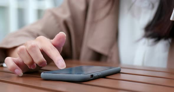 Business woman use cellphone fro online