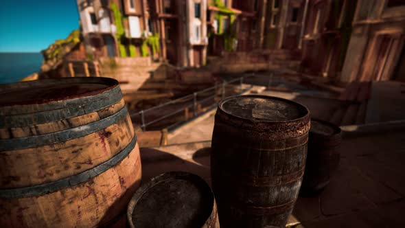 Old Wooden Wine Barrels in a Sea Town Port