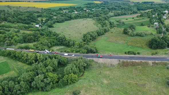 Aerial view of the road among nature. Side view of the highway 