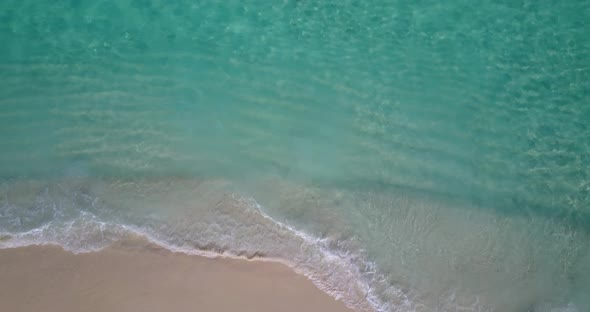 Natural aerial abstract shot of a white sandy paradise beach and blue ocean background in colourful 