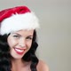 Young woman wearing santa hat and looking up - VideoHive Item for Sale