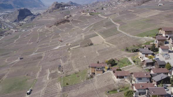 Aerial shot of small village in the vineyard called Signèse. Rhône valley, SwitzerlandSpring time,