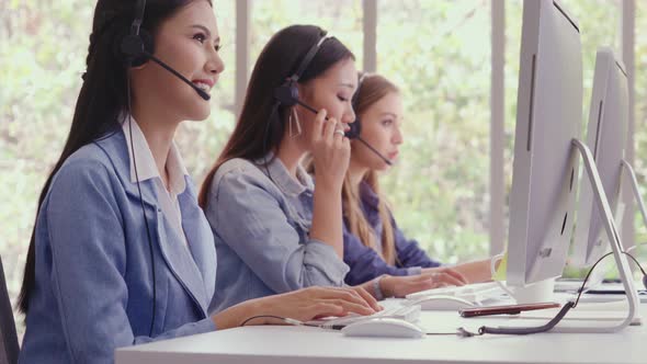 Customer Support Agent or Call Center with Headset Talking to Customer on Phone